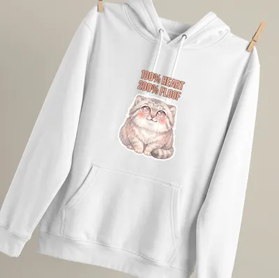 Kawaii illustration of a cute Pallas Cat with the text '100% HEART 200% FLOOF' — printed on a unisex hoodie