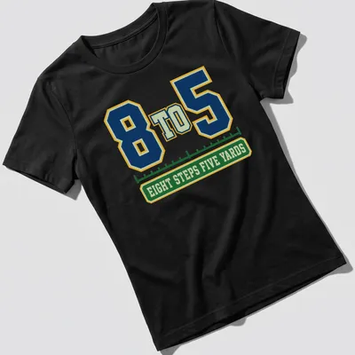 Varsity-style shirt featuring a marching band with bold lettering in navy, green, yellow, and white — printed on a women's shirt