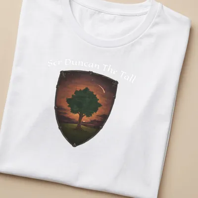 Illustrative tree design in green, orange, brown, and black for a fantasy theme — printed on a women's shirt