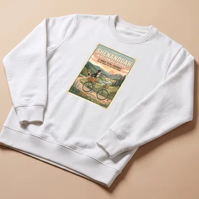 Bernese mountain dog on a bicycle with retro text for Shenandoah National Park — printed on a unisex sweatshirt