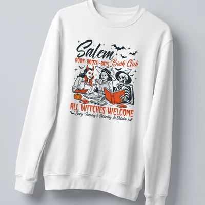 Vintage illustration of witches reading books with Halloween theme — printed on a unisex sweatshirt