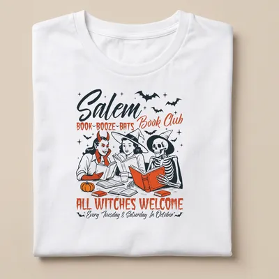 Vintage illustration of witches reading books with Halloween theme — printed on a unisex t-shirt