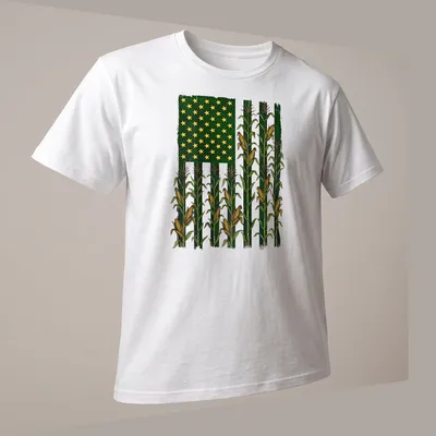 Vintage distressed t-shirt with American Flag over a corn field graphic — printed on a unisex t-shirt (angled view)