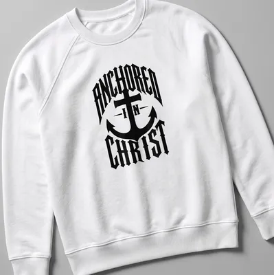 Bold typography Anchor design with 'ANCHORED IN CHRIST' text on black — printed on a unisex sweatshirt