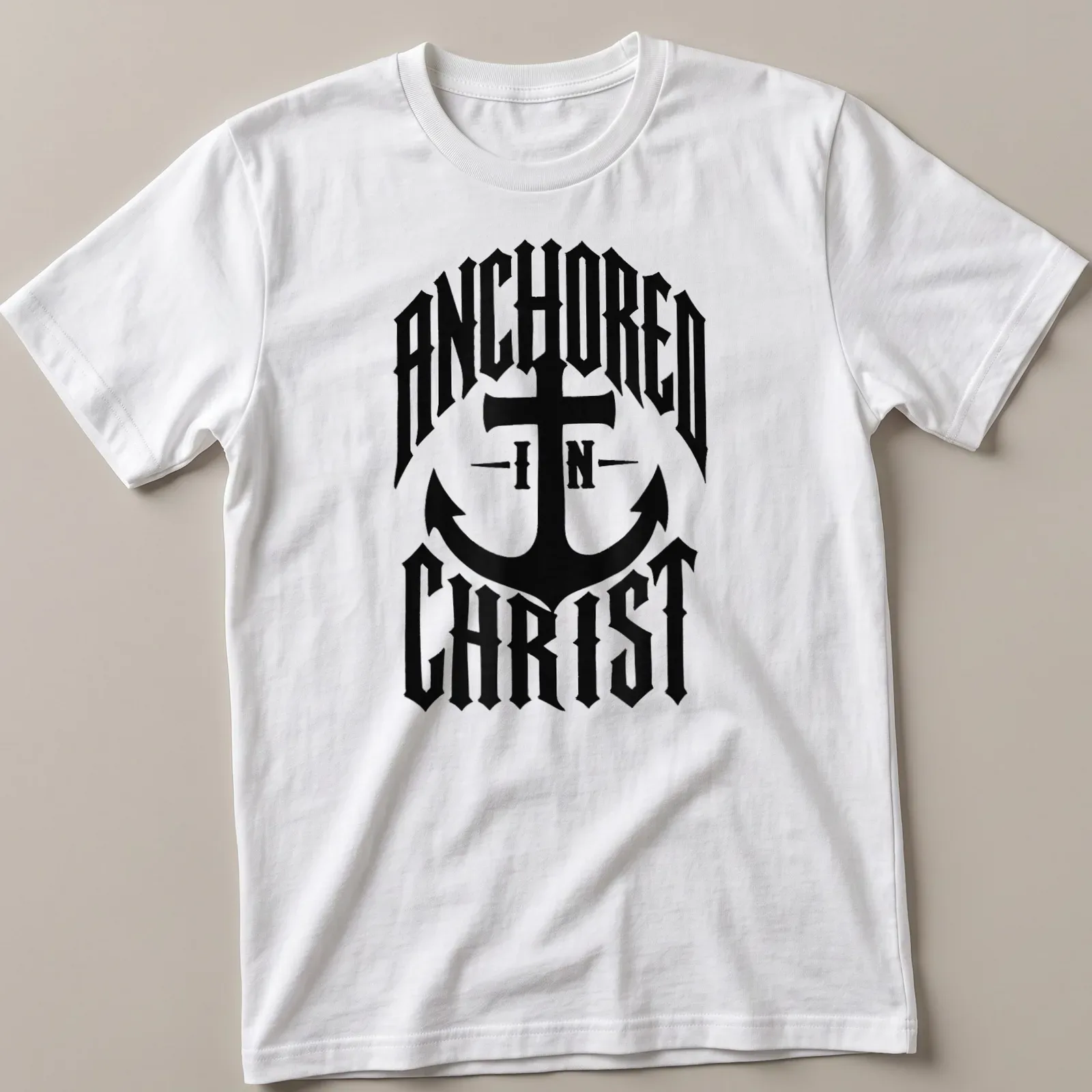 Bold typography Anchor design with 'ANCHORED IN CHRIST' text on black — printed on a unisex t-shirt