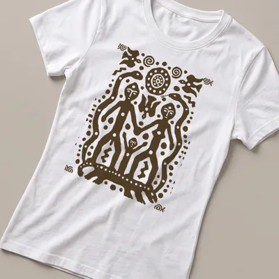 Tribal art T-shirt featuring petroglyph figures and bold text — printed on a women's shirt