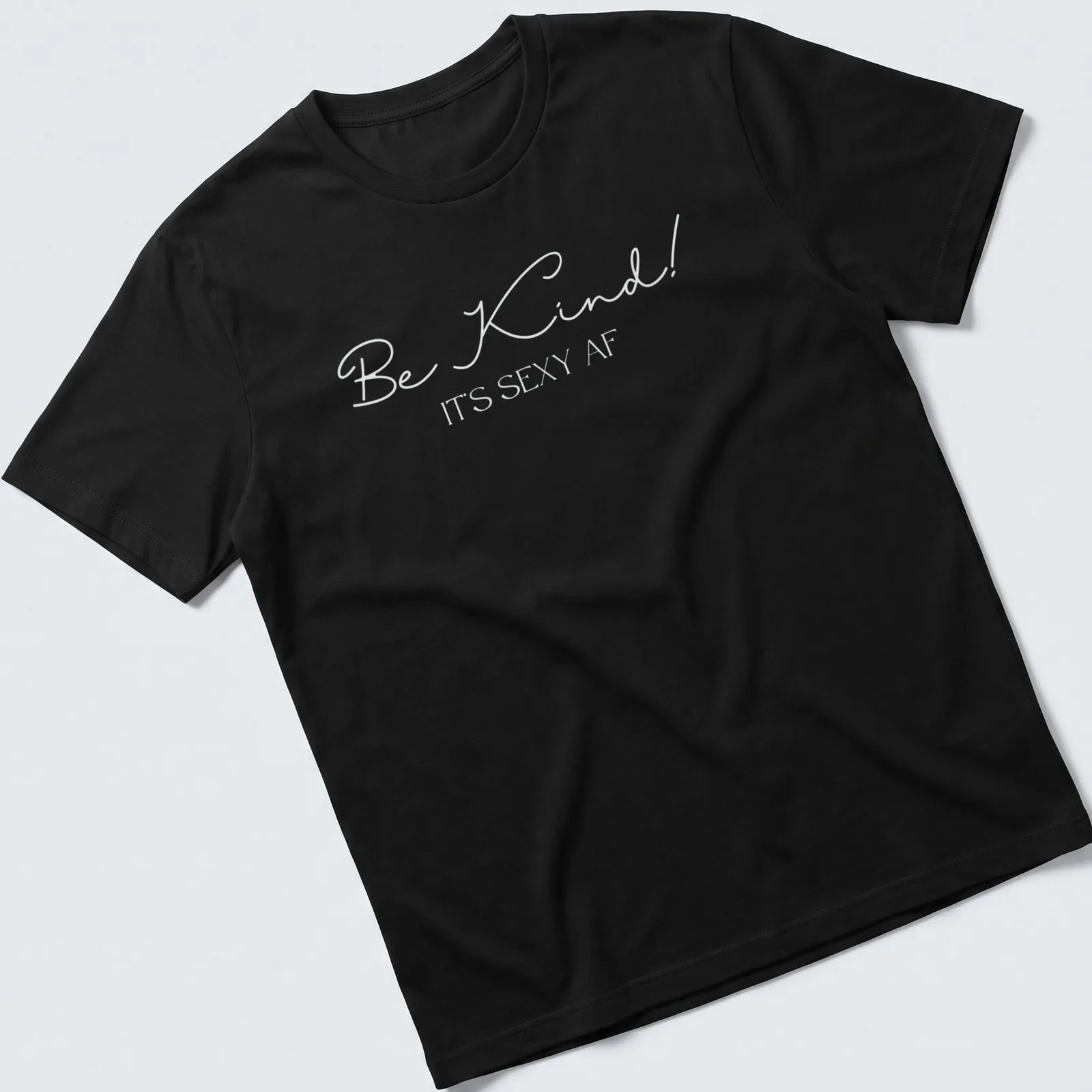Playful typography shirt with the phrase 'Be Kind! It's Sexy AF' — printed on a unisex t-shirt