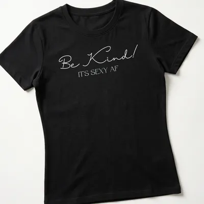 Playful typography shirt with the phrase 'Be Kind! It's Sexy AF' — printed on a women's shirt