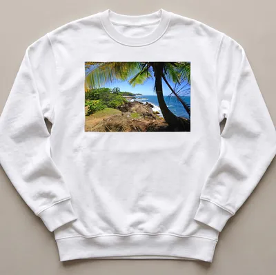 Vivid tropical landscape featuring a beach in Dorado, Puerto Rico — printed on a unisex sweatshirt