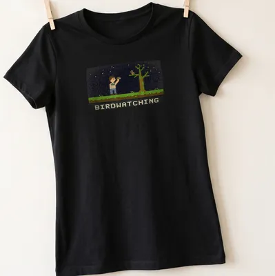 Retro pixel art of a bird watcher with binoculars and text reading Birdwatching — printed on a women's shirt