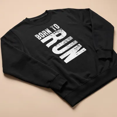 Bold typography shirt featuring the text Born To Run with running shoes graphic — printed on a unisex sweatshirt