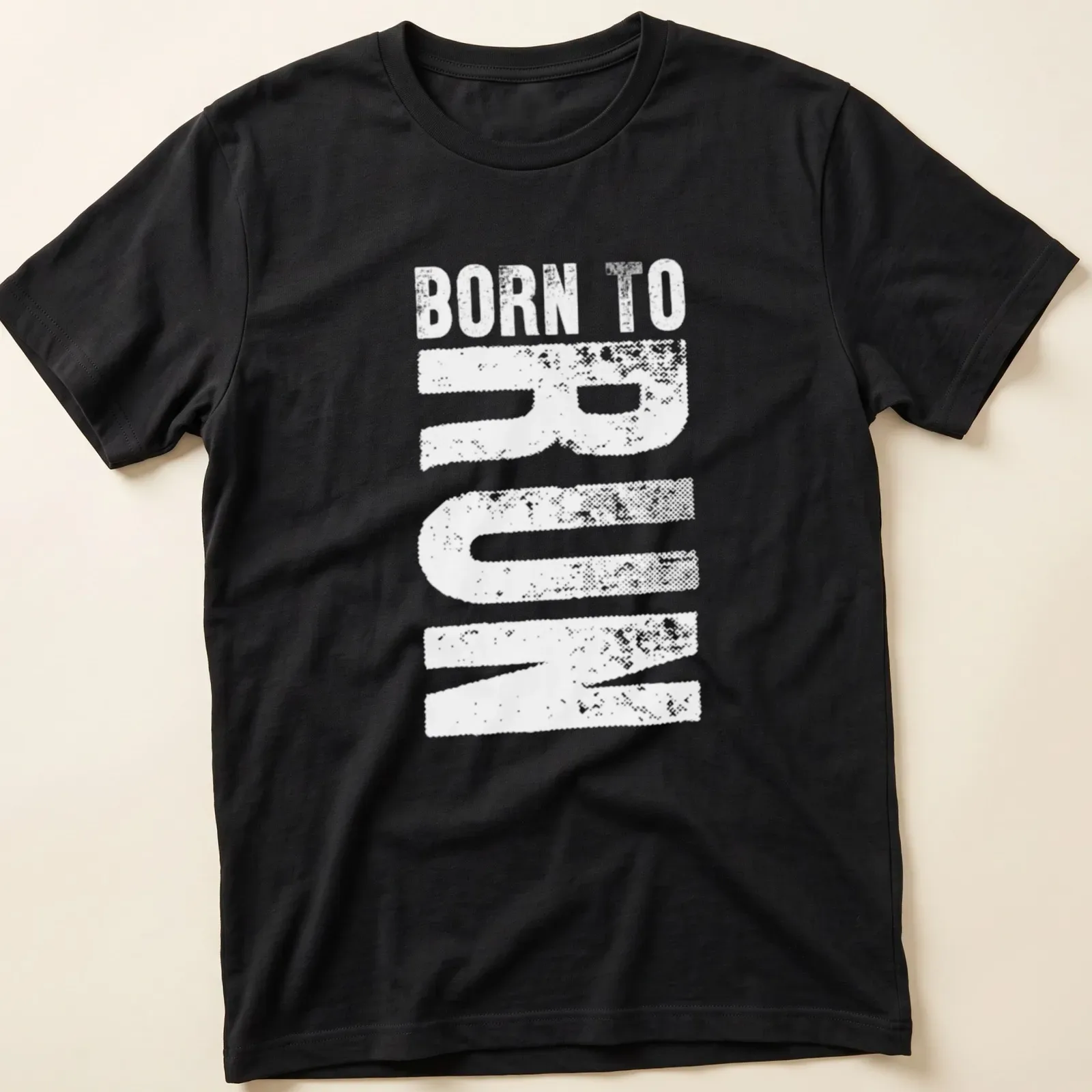 Bold typography shirt featuring the text Born To Run with running shoes graphic — printed on a unisex t-shirt