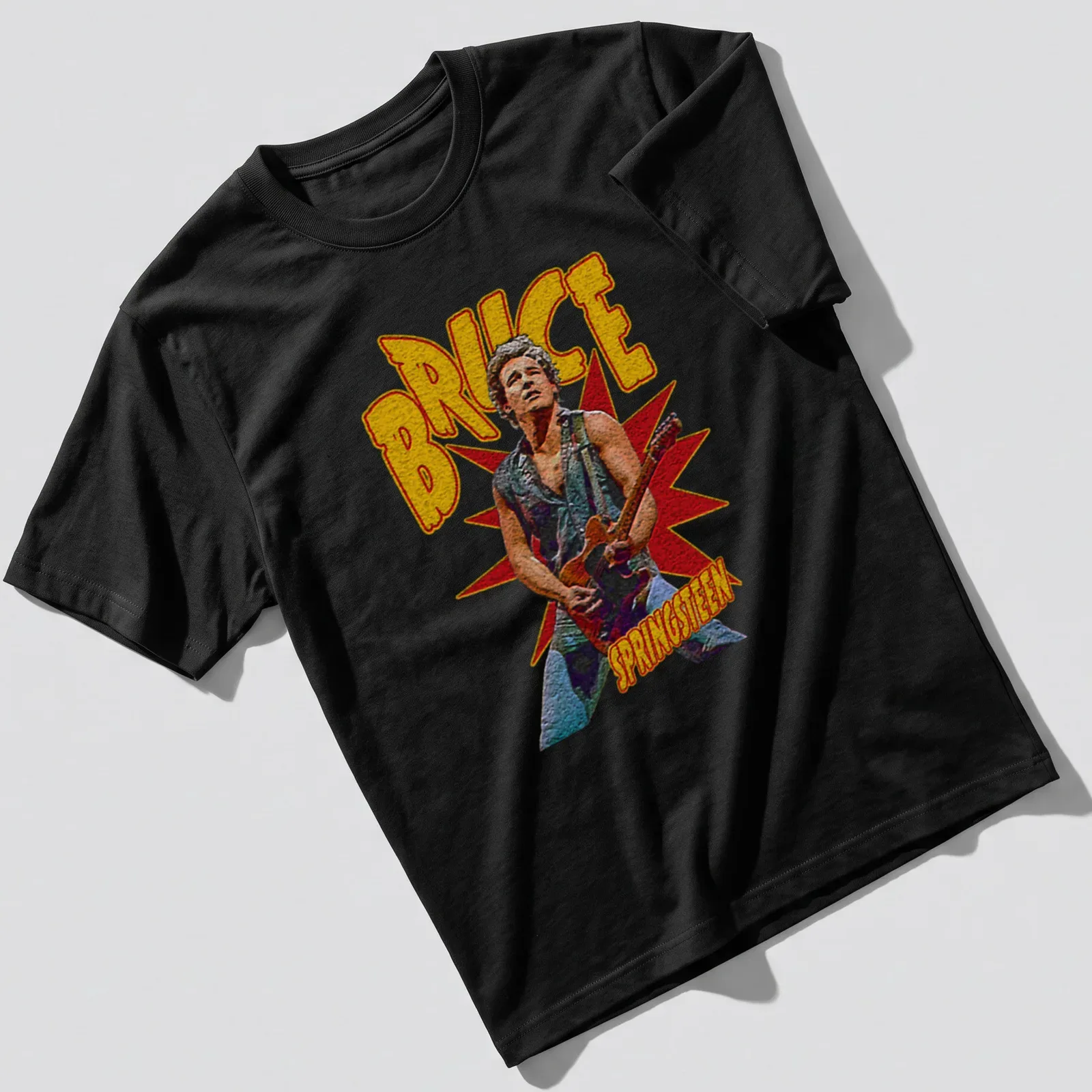 Vintage Bruce Springsteen t-shirt featuring retro typography in yellow, red, black, and gray. — printed on a unisex t-shirt