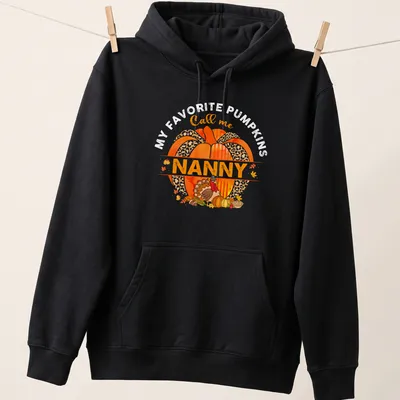 Watercolor design with a pumpkin and turkey above the text 'Call me Nanny' — printed on a unisex hoodie