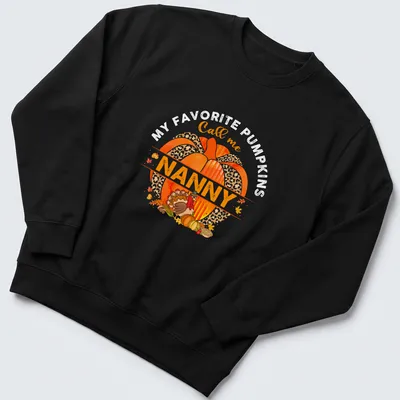 Watercolor design with a pumpkin and turkey above the text 'Call me Nanny' — printed on a unisex sweatshirt