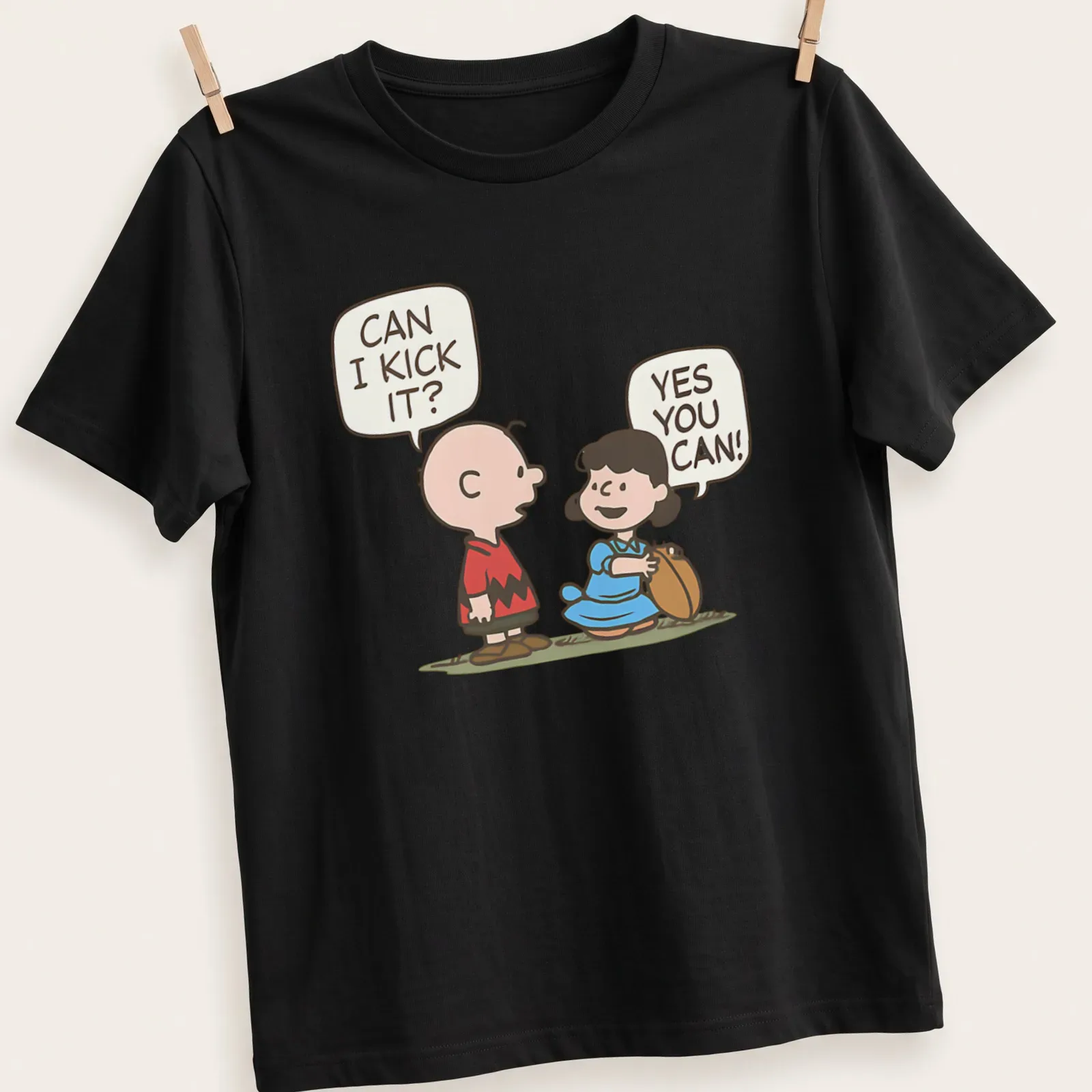 Kawaii Charlie Brown and Lucy football t-shirt with fun text and vibrant colors — printed on a unisex t-shirt