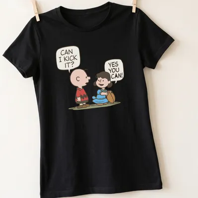 Kawaii Charlie Brown and Lucy football t-shirt with fun text and vibrant colors — printed on a women's shirt