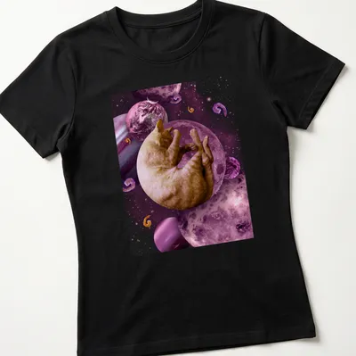 Illustration of a sleeping cat in space with cosmic elements in pink and purple. — printed on a women's shirt