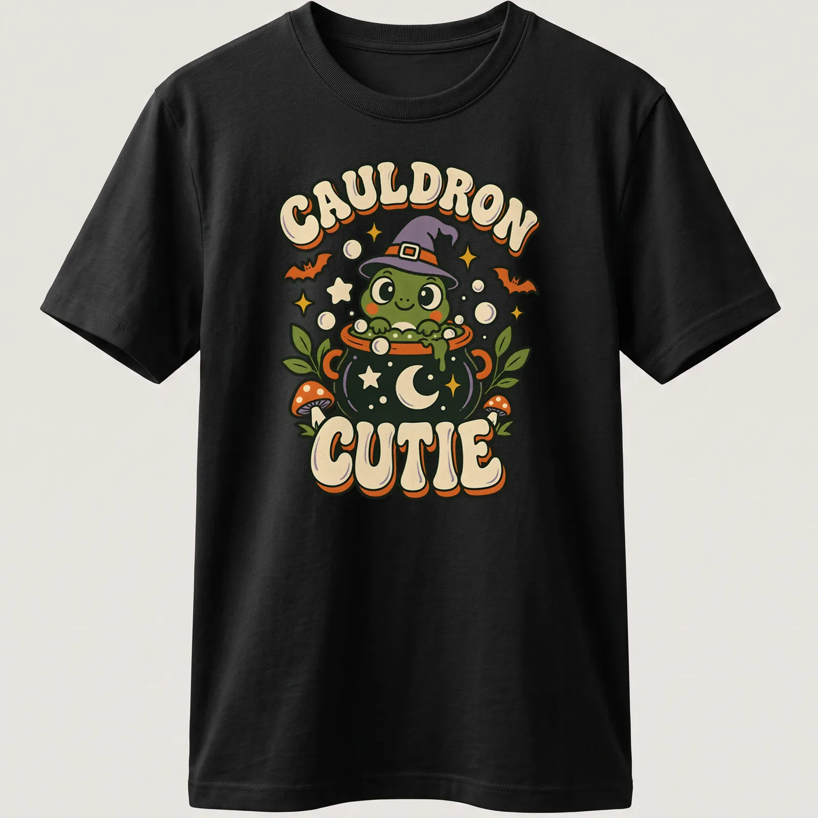Kawaii frog witch with cauldron and text on a Halloween — printed on a unisex t-shirt