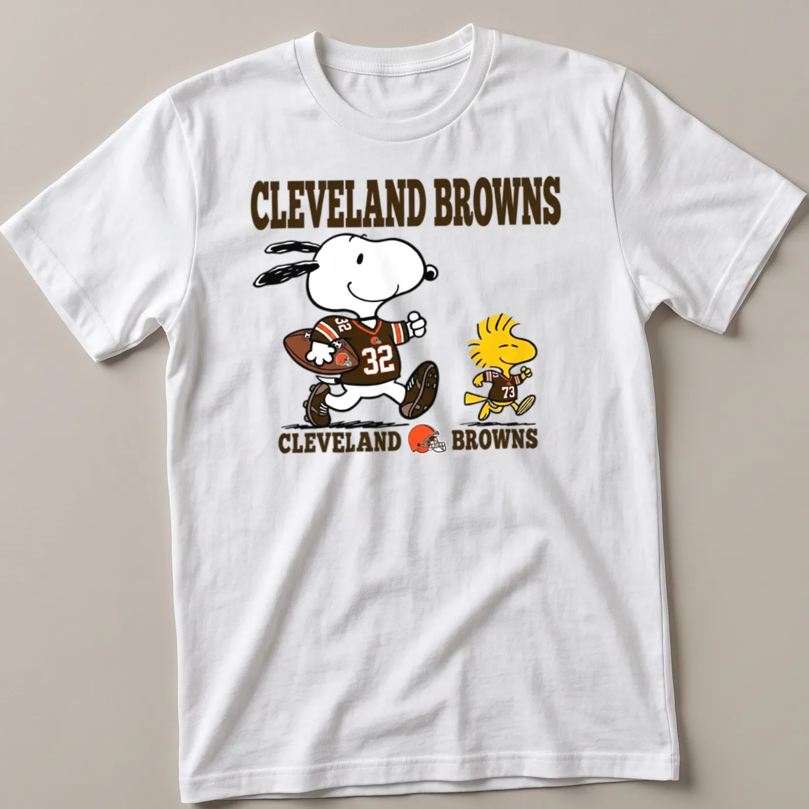 Cartoon design of Snoopy and Woodstock in football gear with Cleveland Browns text — printed on a unisex t-shirt