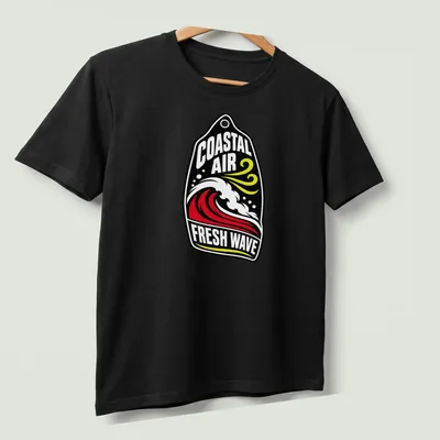 Bold graphic surfing wave t-shirt featuring Coastal Air Fresh Wave text — printed on a unisex t-shirt (angled view)