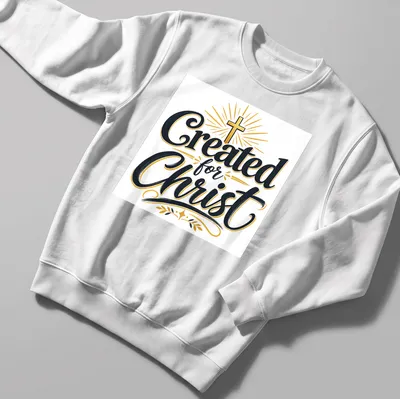 Typography design featuring the text 'Created for Christ' with a Christian cross — printed on a unisex sweatshirt