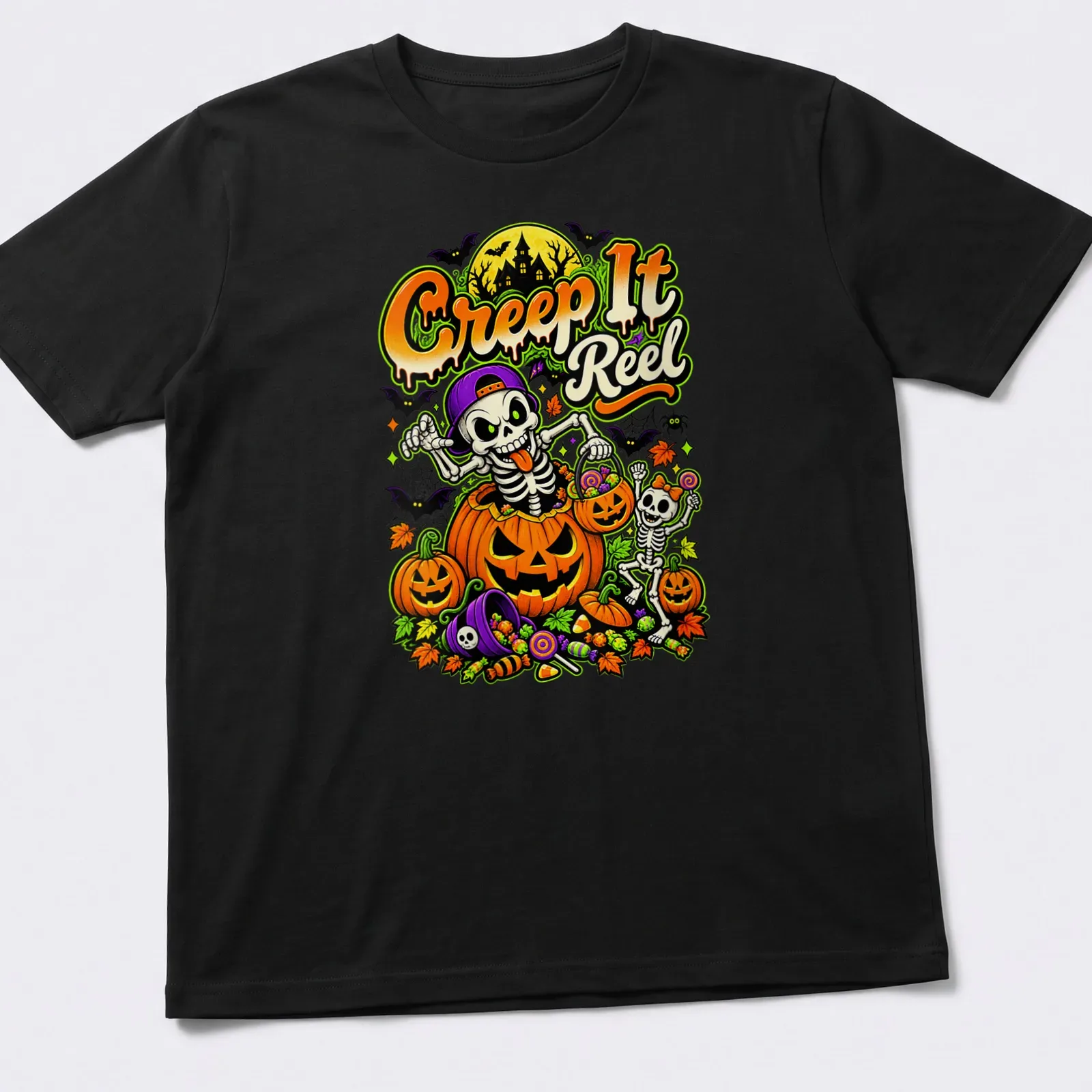 Colorful cartoon of skeletons and pumpkins with the text Creep It Reel for Halloween — printed on a unisex t-shirt