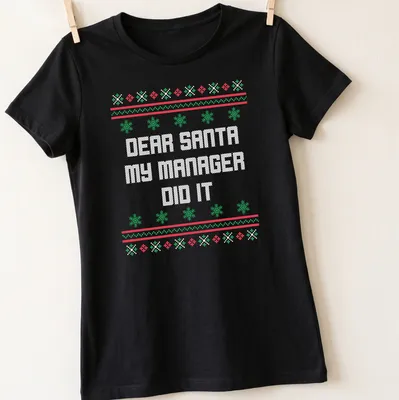 Ugly Christmas shirt with humorous text about a manager and Santa in red, green, and white. — printed on a women's shirt