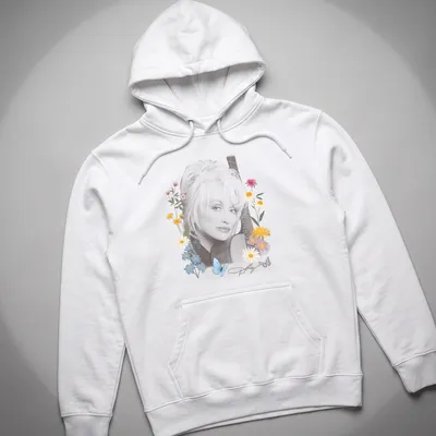 Dolly Parton portrait surrounded by flowers and butterflies in pastel colors — printed on a unisex hoodie