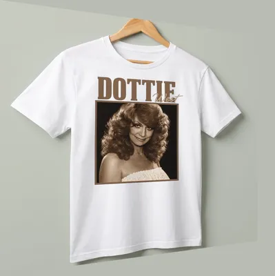 Vintage-style Dottie West t-shirt featuring her name in nostalgic typography — printed on a unisex t-shirt (angled view)