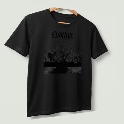 Black and white silhouette of a tree with 'EDALINE' printed above. — printed on a unisex t-shirt (angled view)