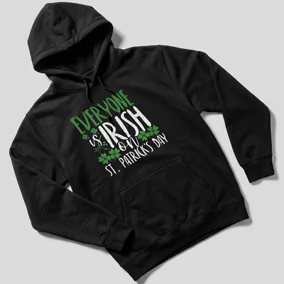 Vintage distressed T-shirt featuring shamrock and St. Patrick's Day text — printed on a unisex hoodie