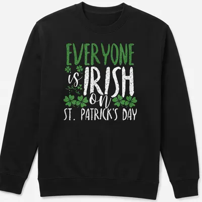 Vintage distressed T-shirt featuring shamrock and St. Patrick's Day text — printed on a unisex sweatshirt