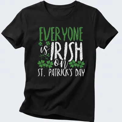 Vintage distressed T-shirt featuring shamrock and St. Patrick's Day text — printed on a women's shirt