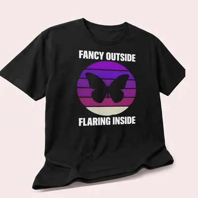 Retro butterfly graphic with the phrase Fancy Outside Flaring Inside in purple, pink, white, and beige. — printed on a unisex t-shirt (angled view)