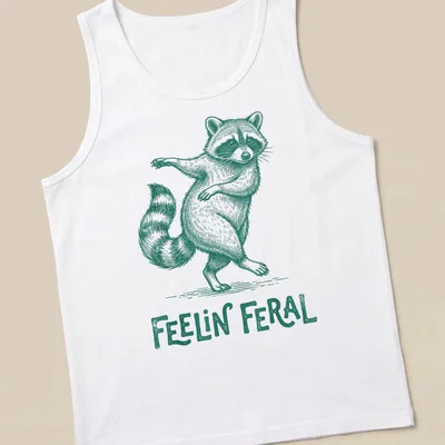 Green vintage illustration of a playful raccoon with the text 'Feelin' Feral' — printed on a tank top