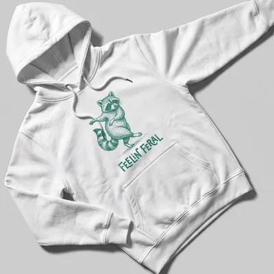Green vintage illustration of a playful raccoon with the text 'Feelin' Feral' — printed on a unisex hoodie