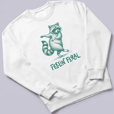 Green vintage illustration of a playful raccoon with the text 'Feelin' Feral' — printed on a unisex sweatshirt