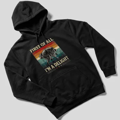 Vintage distressed t-shirt featuring a playful raccoon and humorous text. — printed on a unisex hoodie