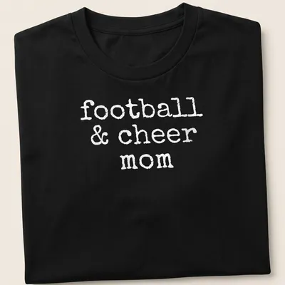 Playful typography of football & cheer mom T-shirt in bold white. — printed on a unisex t-shirt