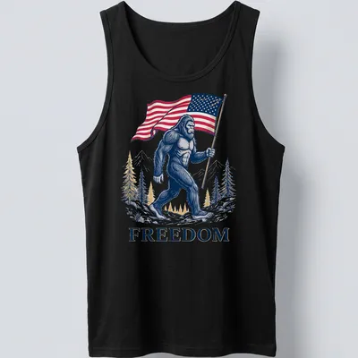 Detailed illustration of Bigfoot holding an American flag with the text FREEDOM — printed on a tank top