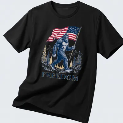 Detailed illustration of Bigfoot holding an American flag with the text FREEDOM