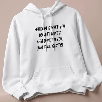Bold handwritten text of Sartre's quote on freedom in black and white — printed on a unisex hoodie