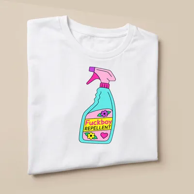 Colorful cartoon graphic of a spray bottle with the text 'Fuckboy REPPELLENT' — printed on a unisex t-shirt (angled view)
