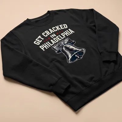 Vintage-style t-shirt featuring the Liberty Bell with humorous text about getting cracked in Philadelphia — printed on a unisex sweatshirt
