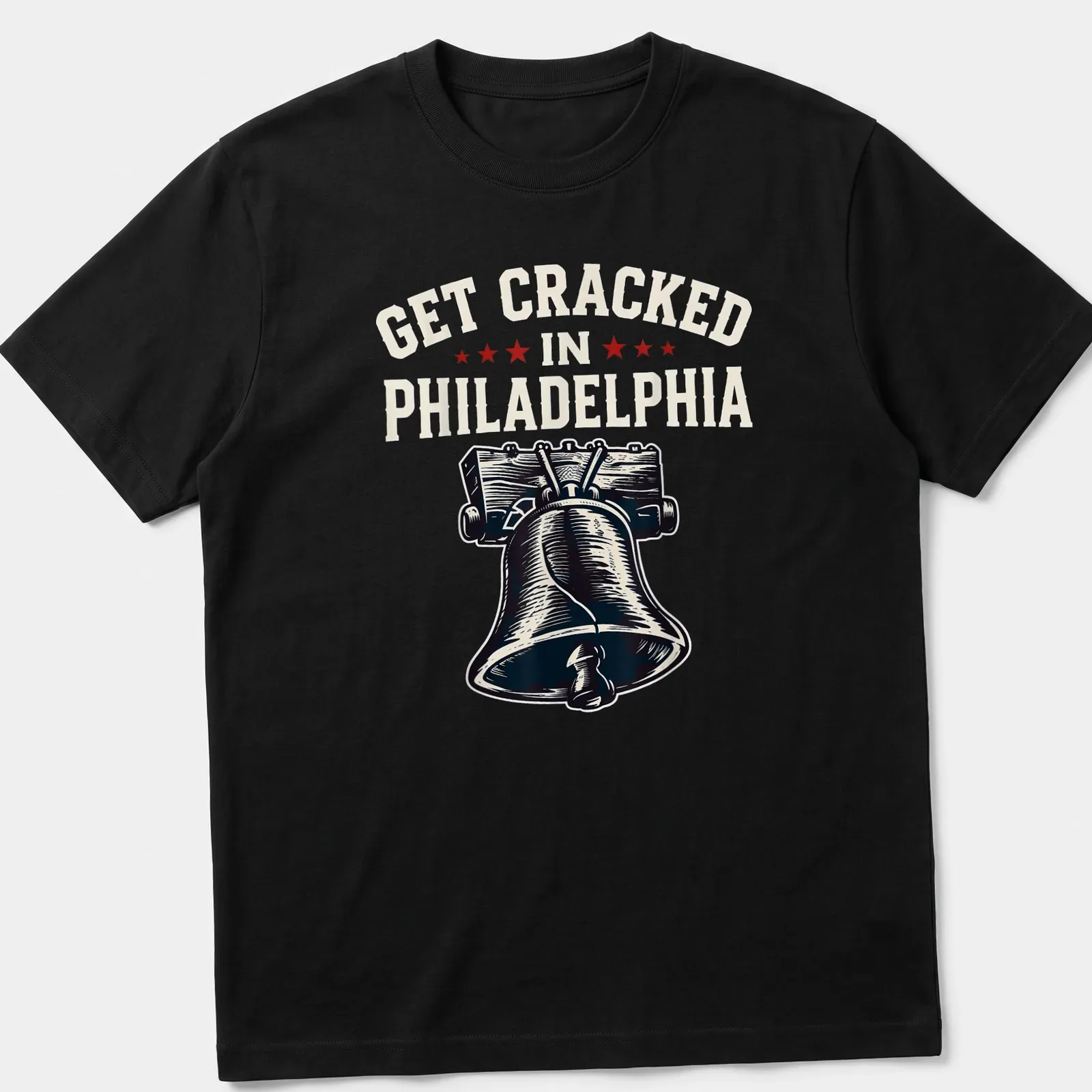 Vintage-style t-shirt featuring the Liberty Bell with humorous text about getting cracked in Philadelphia — printed on a unisex t-shirt