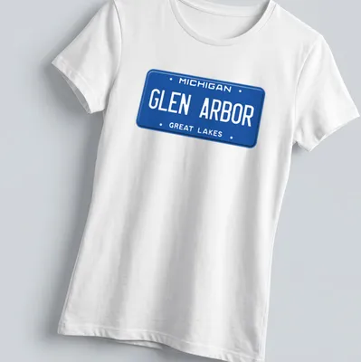 Vintage-style Michigan Glen Arbor license plate graphic — printed on a women's shirt