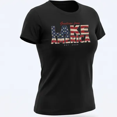 Vintage distressed t-shirt featuring patriotic text and lake imagery. — printed on a women's shirt