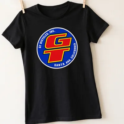 Vintage BMX T-shirt featuring GT Bicycles logo in blue, red, yellow, and white — printed on a women's shirt