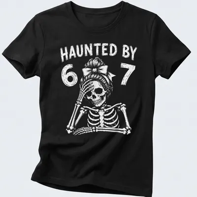 Cartoon skeleton teacher graphic with the text 'Haunted By 67' in black and white — printed on a women's shirt